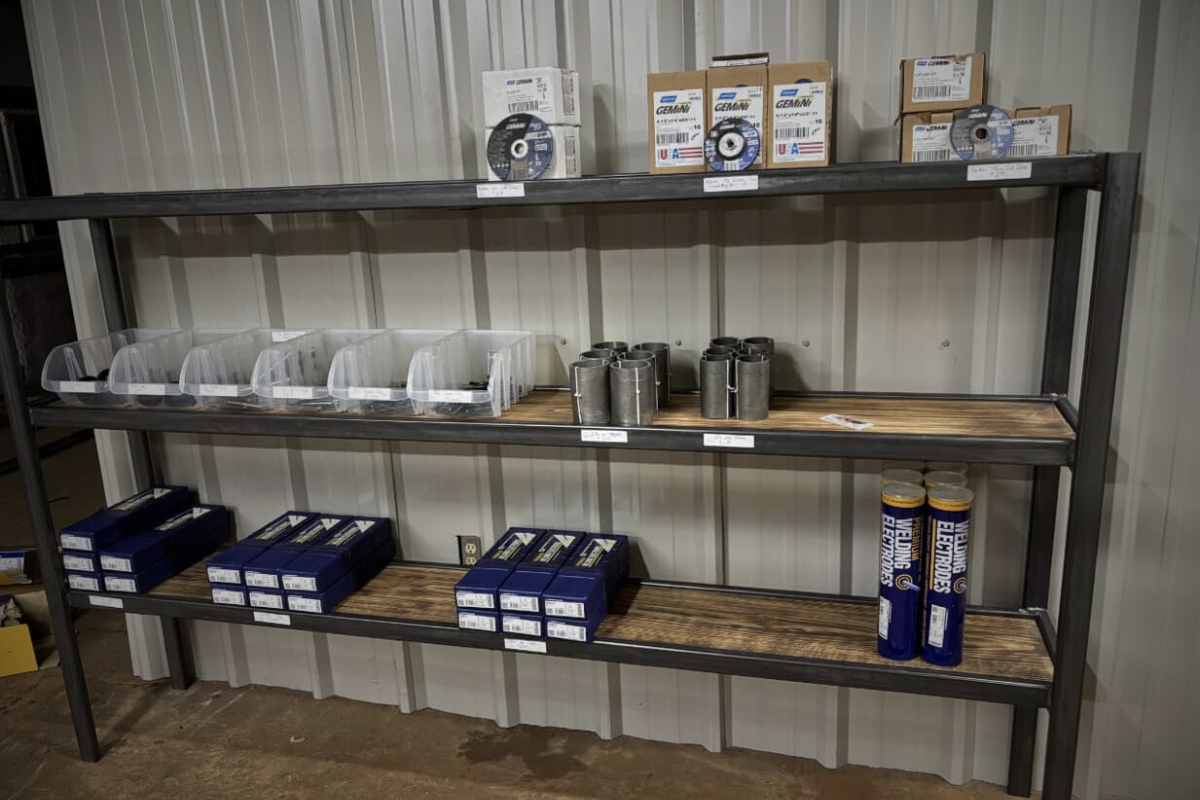Shelf of welding supplies at Dunn Welding & Custom Fab shop in Buffalo, TX